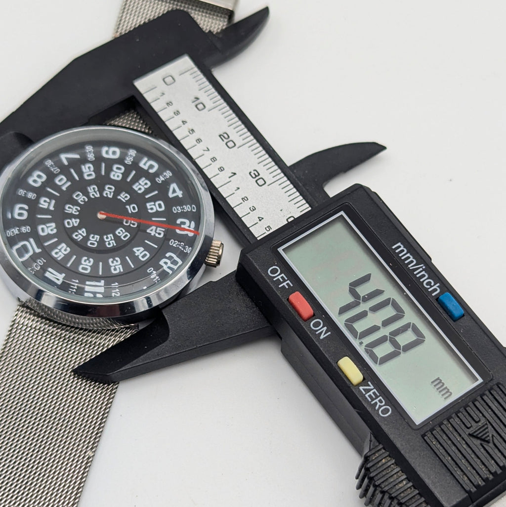 Raidu Spinning Disc Novelty Watch — Quartz, Mesh Strap, Sold Naked - Bezel & Hide