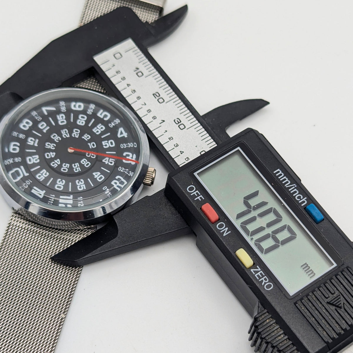 Raidu Spinning Disc Novelty Watch — Quartz, Mesh Strap, Sold Naked - Bezel & Hide