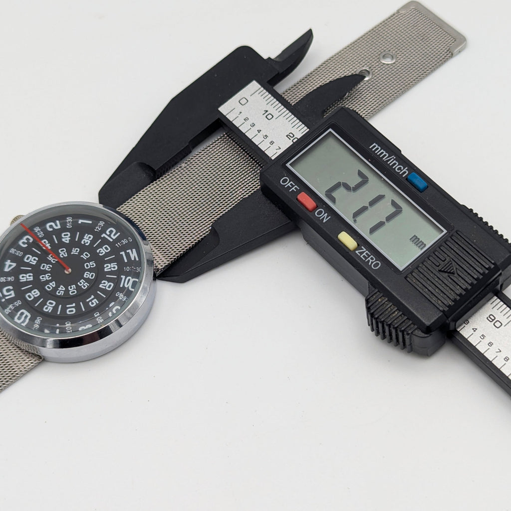 Raidu Spinning Disc Novelty Watch — Quartz, Mesh Strap, Sold Naked - Bezel & Hide