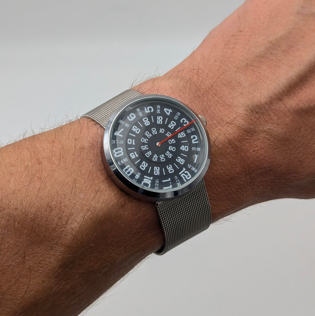 Raidu Spinning Disc Novelty Watch — Quartz, Mesh Strap, Sold Naked - Bezel & Hide