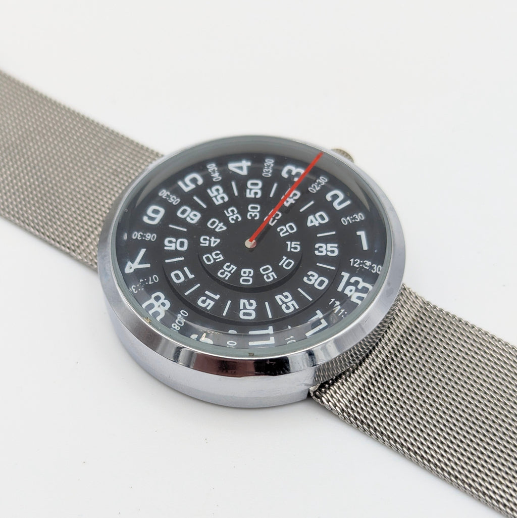 Raidu Spinning Disc Novelty Watch — Quartz, Mesh Strap, Sold Naked - Bezel & Hide