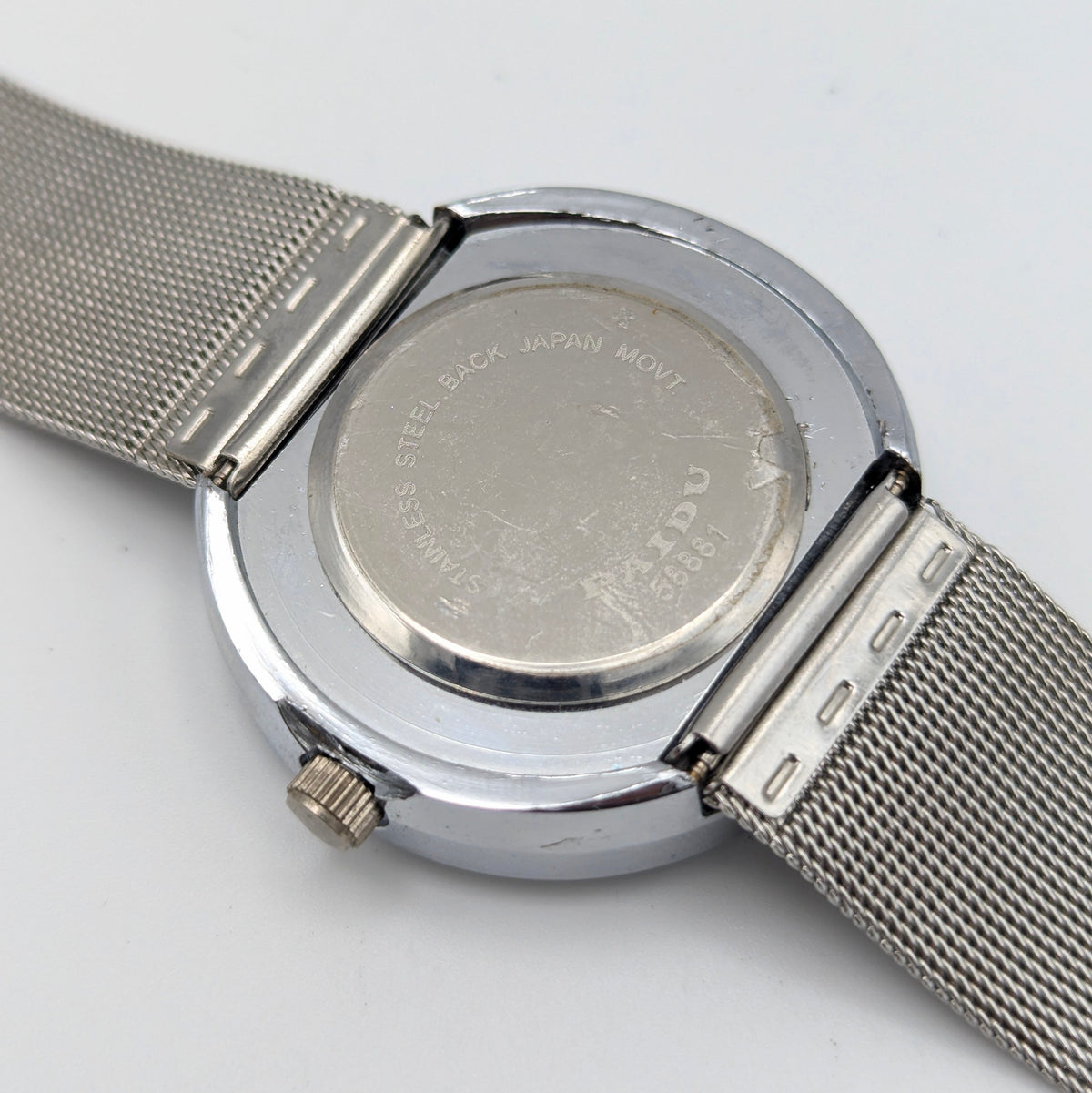 Raidu Spinning Disc Novelty Watch — Quartz, Mesh Strap, Sold Naked - Bezel & Hide