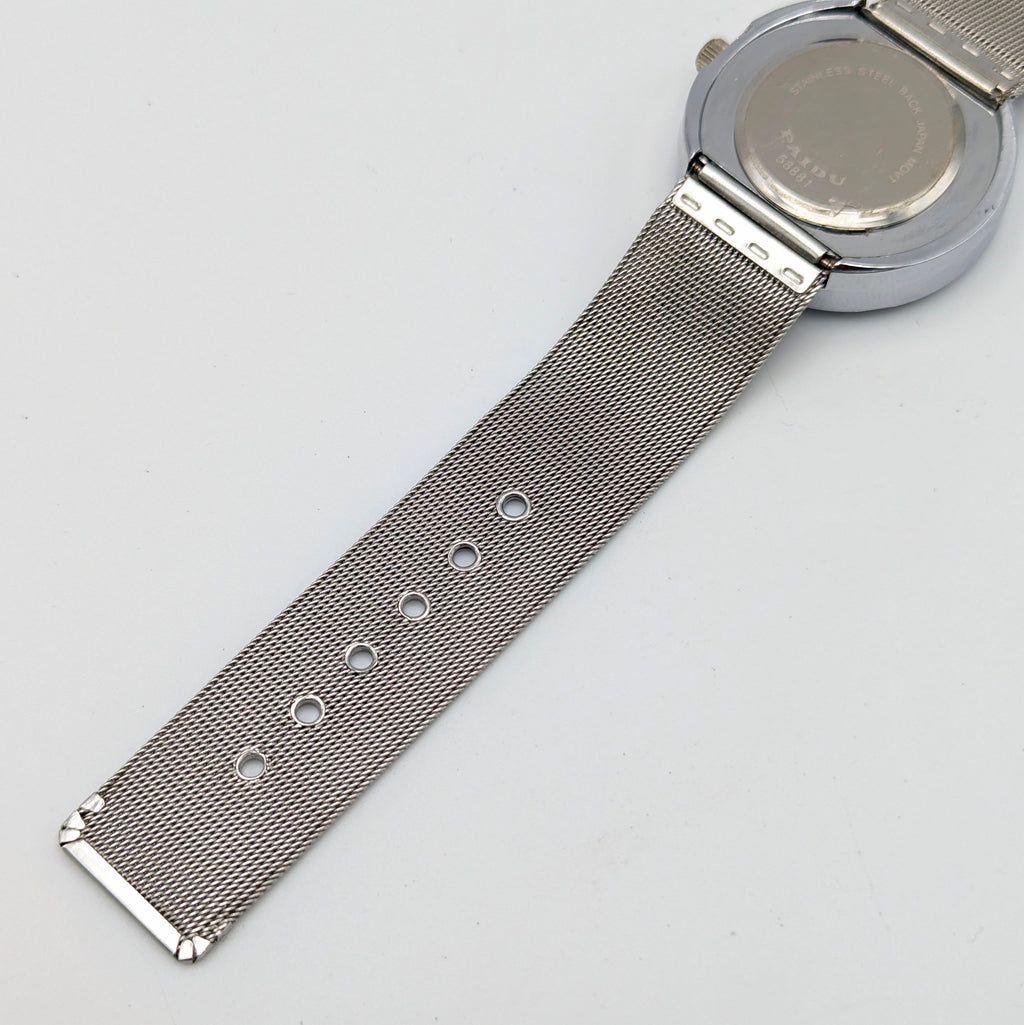 Raidu Spinning Disc Novelty Watch — Quartz, Mesh Strap, Sold Naked - Bezel & Hide