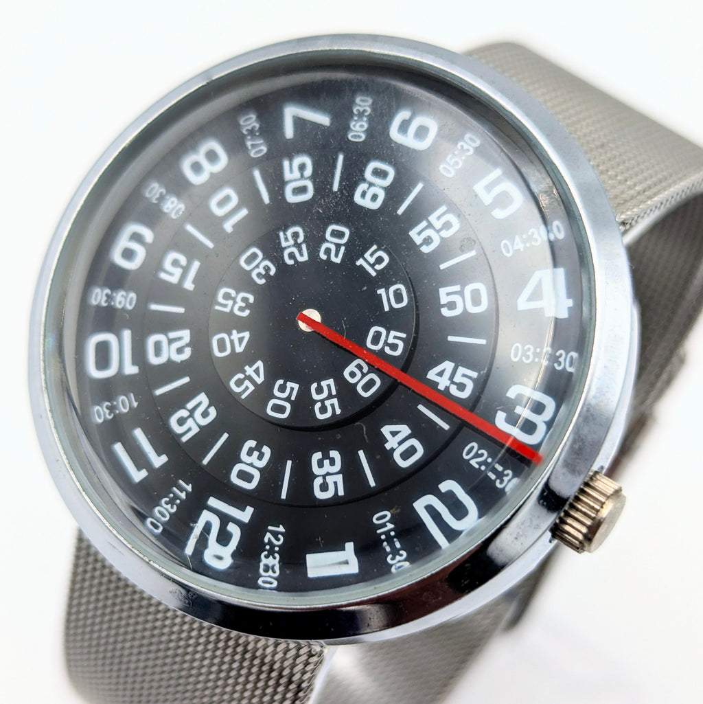 Raidu Spinning Disc Novelty Watch — Quartz, Mesh Strap, Sold Naked - Bezel & Hide