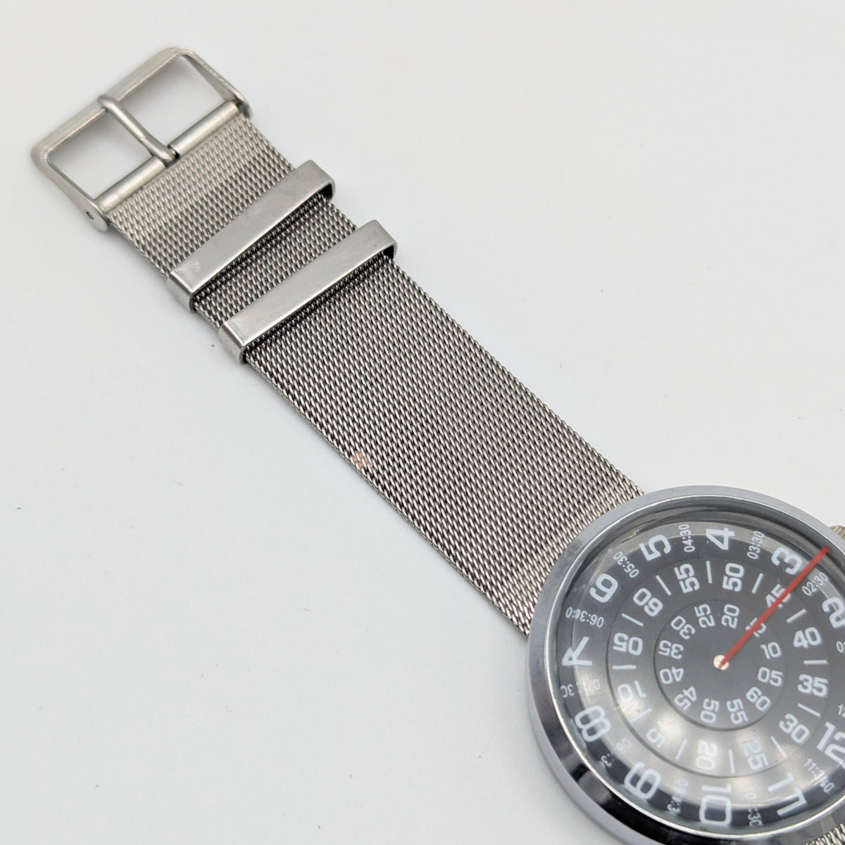 Raidu Spinning Disc Novelty Watch — Quartz, Mesh Strap, Sold Naked - Bezel & Hide
